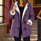 Woman wearing the fleece lined duffle coat in purple