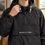 Additional view 2 of the Green anorak jacket showing the drawcord hood and half-zip front and construction