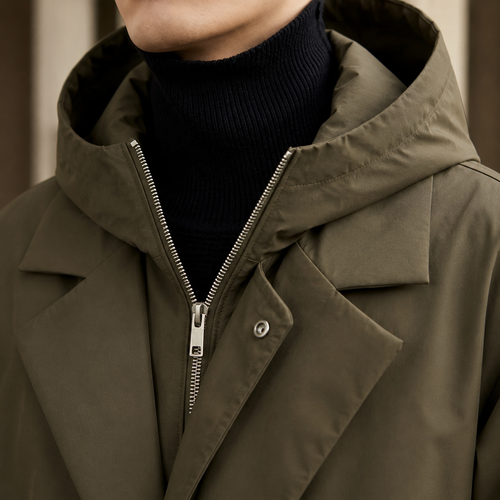 Additional view 2 of the Black hooded overcoat showing the layered lapel and attached hood and construction