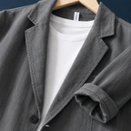Additional view 2 of the Black linen jacket showing the notched lapels and patch pockets and construction