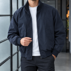 Flight Jacket in Navy Blue showing the concealed zip and ribbed trims