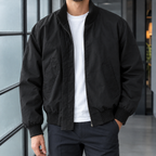 Flight Jacket in Black showing the concealed zip and ribbed trims