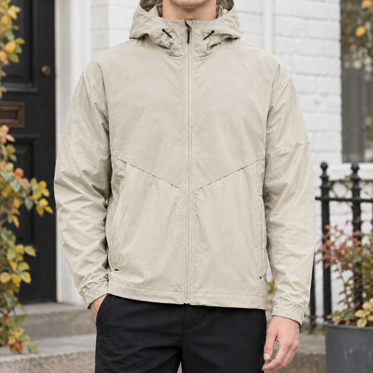 Hooded Jacket in Khaki showing the drawcord hood, chevron yoke, and relaxed fit.
