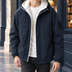 Hooded Jacket in Navy Blue showing the fleece-lined hood, zipped pockets, and elasticated cuffs.