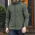 Hooded Utility Jacket in Army Green showing the adjustable hood and three zipped pockets.