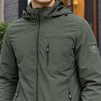 Hooded Utility Jacket detail view 2 showing the adjustable hood and three zipped pockets.