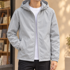 Hooded Jacket in Gray showing the fixed hood and streamlined zip front