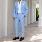 Sky blue two piece suit with notch lapels and matching pants, worn with a white shirt.