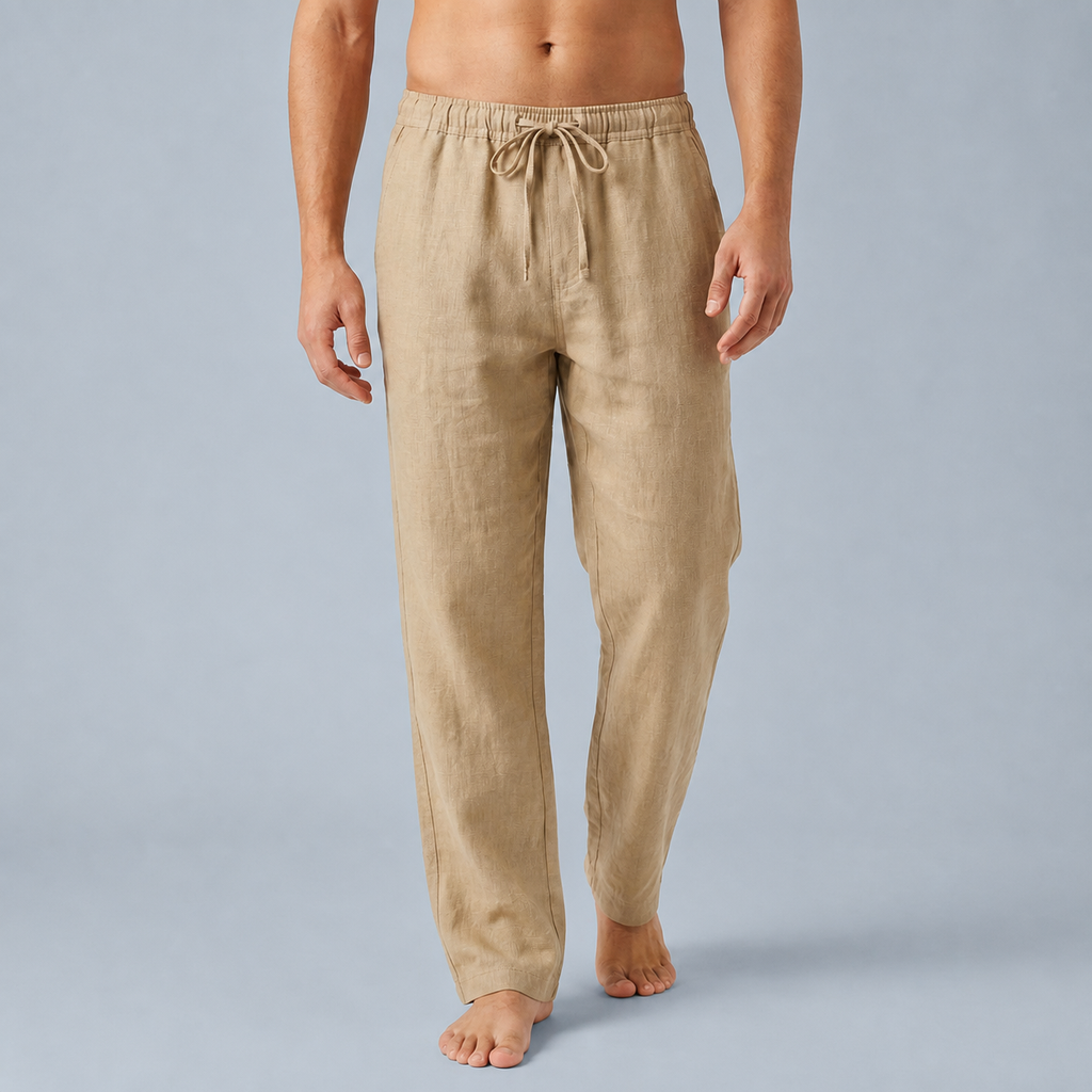 Cream drawstring trousers worn walking with bare feet and bare torso cropped above waist
