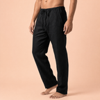 Black drawstring trousers with one bent leg