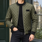 Quilted Bomber Jacket in Military Green showing the diamond quilting and ribbed bomber trims.