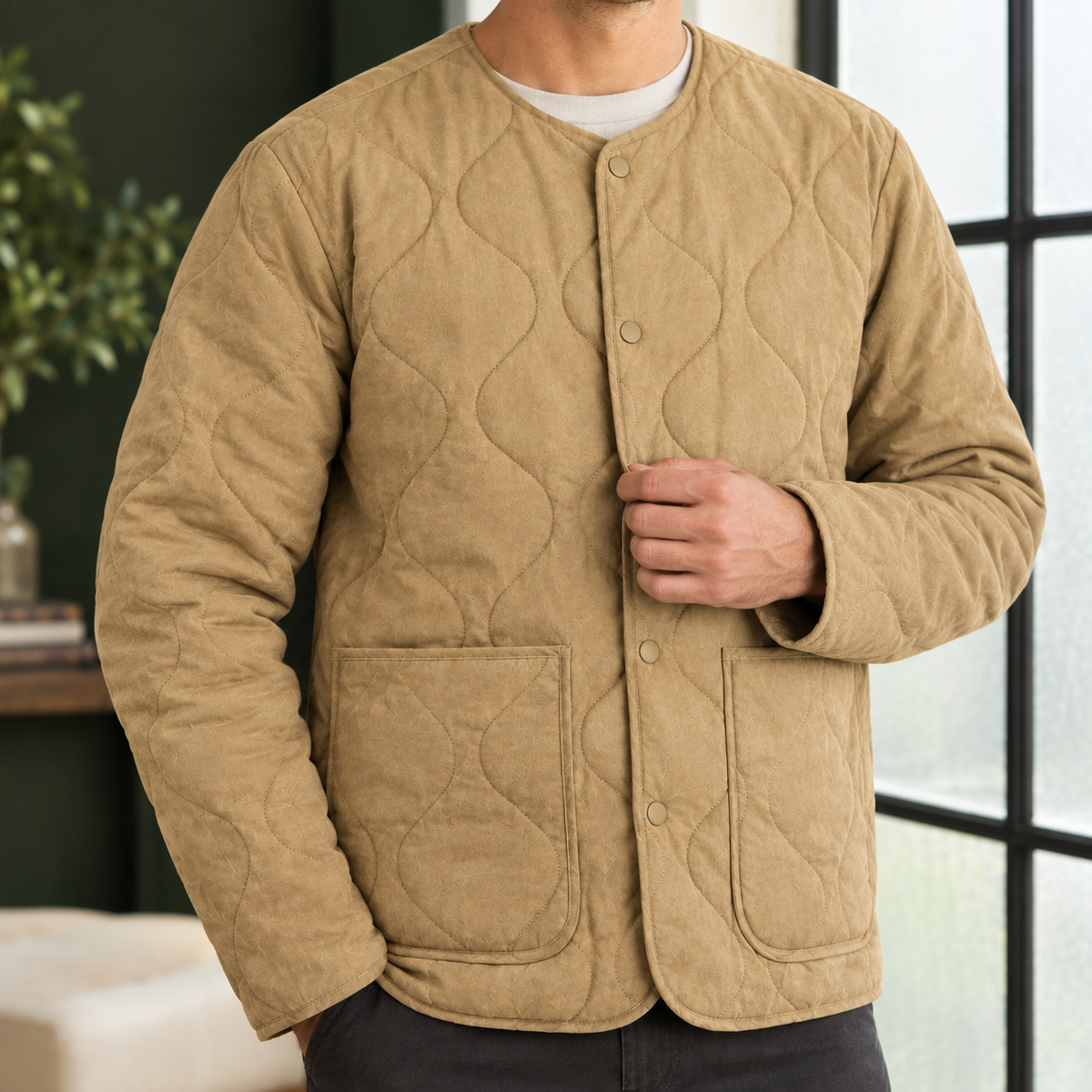 Quilted Jacket detail view 2 showing the soft quilting, collarless neckline, and patch pockets.