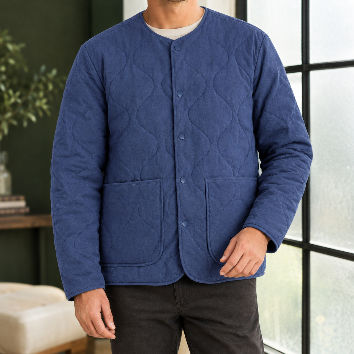 Quilted Jacket in Royal Blue showing the soft quilting, collarless neckline, and patch pockets.