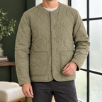 Quilted Jacket in Army Green showing the soft quilting, collarless neckline, and patch pockets.