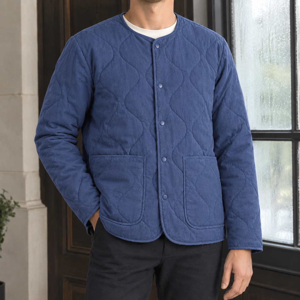 Quilted Jacket in Royal Blue showing the cotton-lined quilting, snap front, and patch pockets.