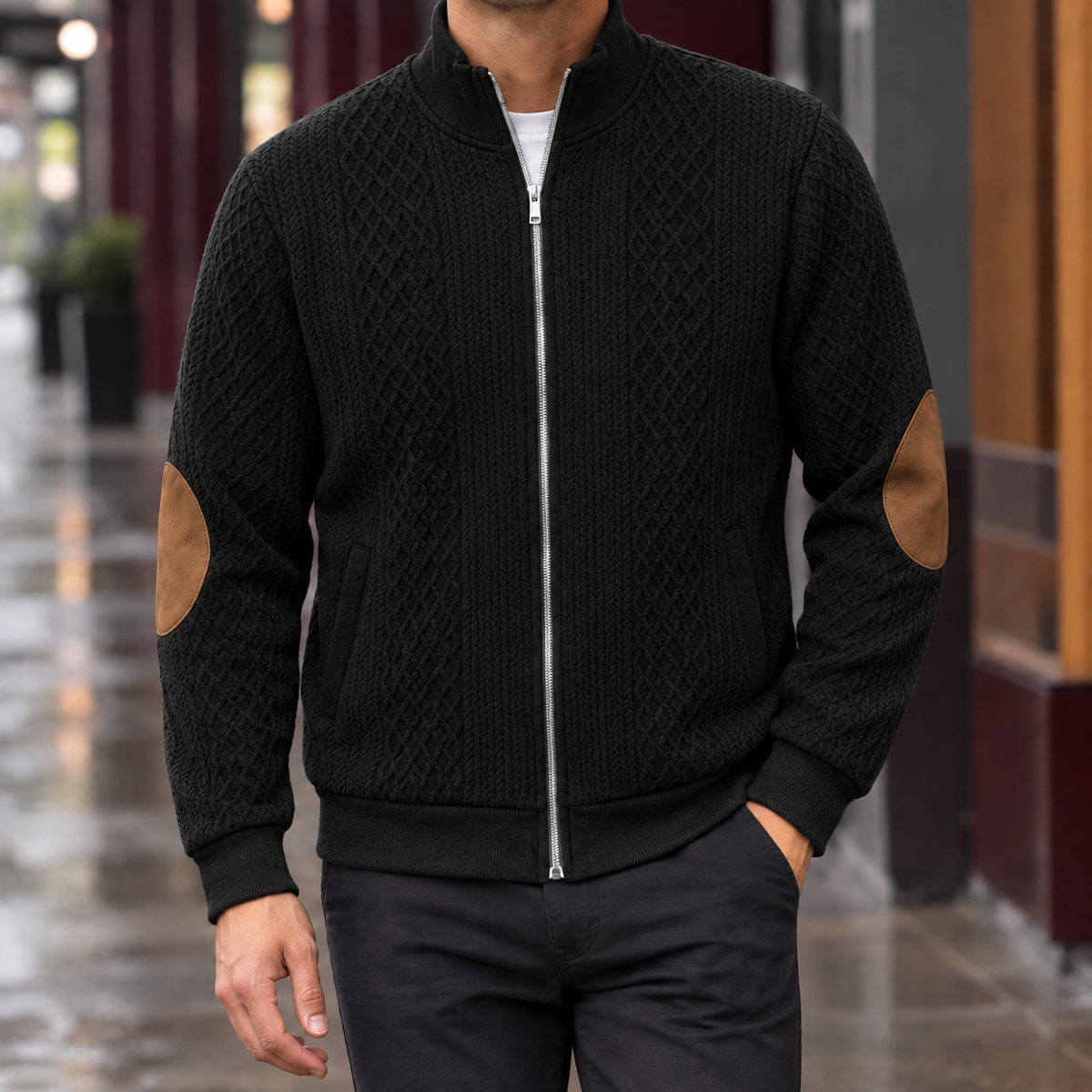Quilted Jacket in Black showing the diamond quilting, leather elbow patches, and ribbed trims.
