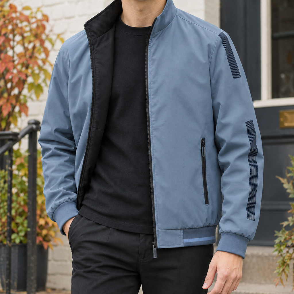 Reversible Jacket in Fog Blue showing the reversible two-tone construction and ribbed trims.