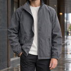 Stand Collar Jacket in Dark Gray showing the tall collar and zipped front pockets.