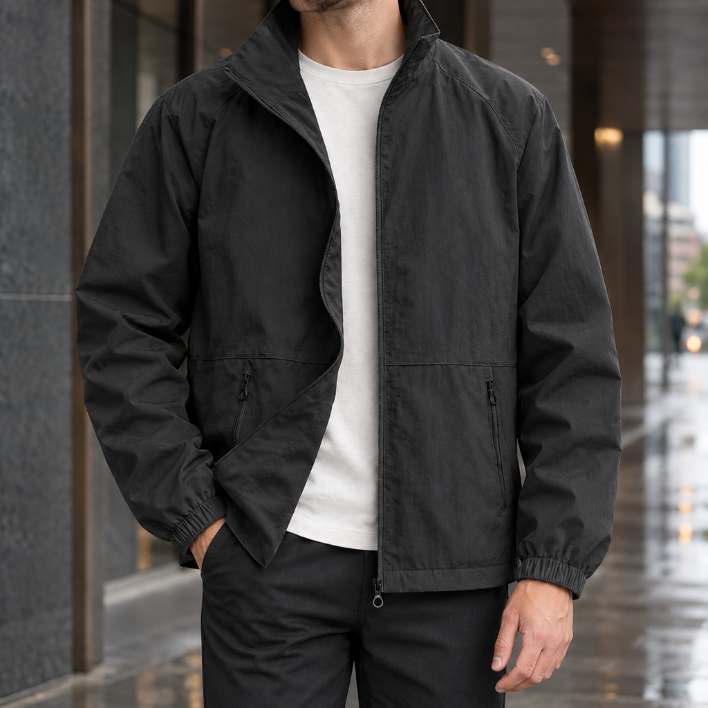 Stand Collar Jacket in Black showing the tall collar and zipped front pockets.