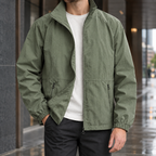 Stand Collar Jacket in Army Green showing the tall collar and zipped front pockets.