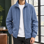 Stand Collar Jacket in Denim Blue showing the stand collar and two zipped pockets.