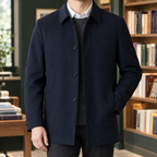 Tailored Jacket in Navy Blue showing the pointed collar and single breasted front.