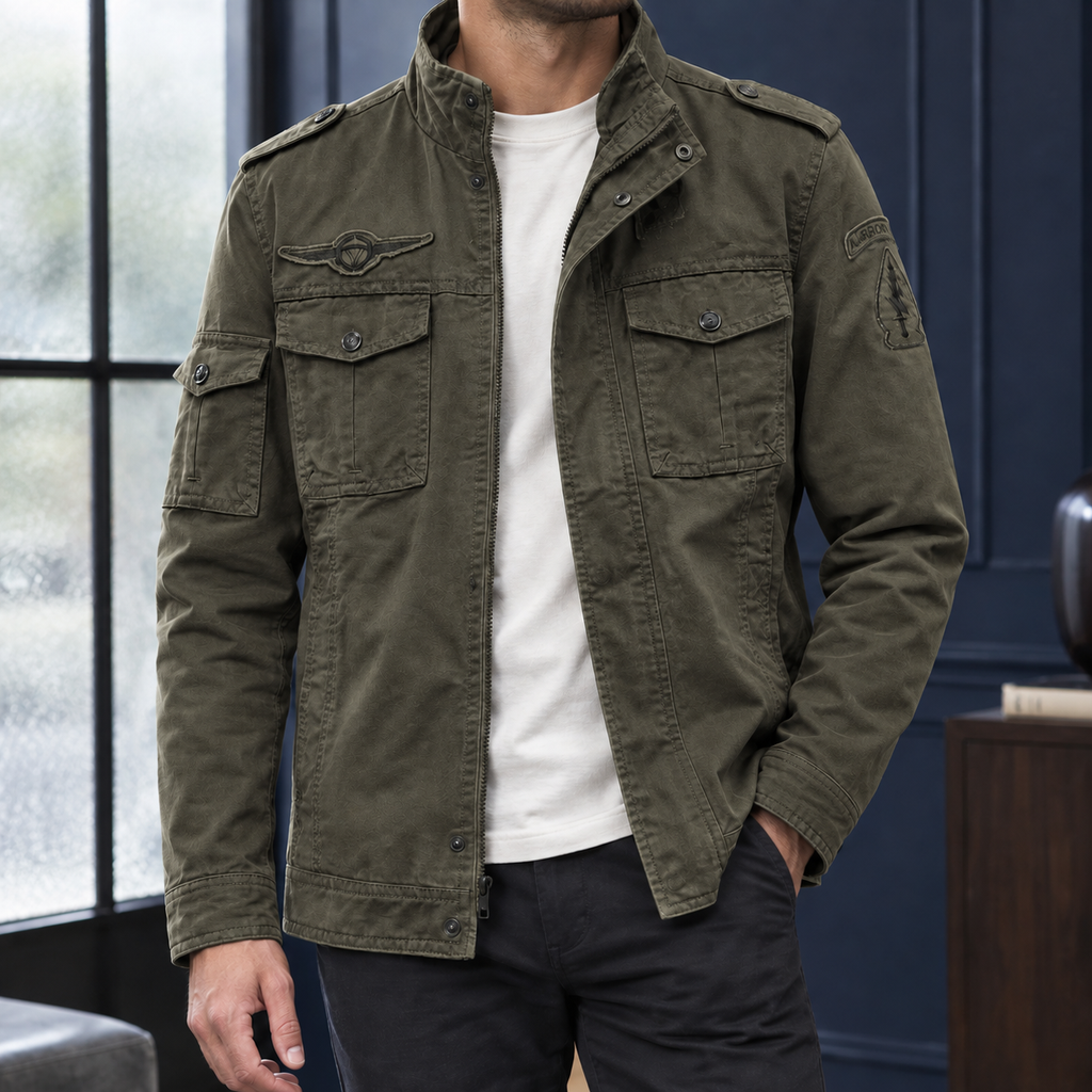 Utility Jacket in Green showing the snap flap pockets and layered front closure.