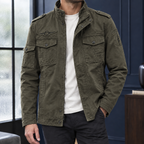 Utility Jacket in Green showing the snap flap pockets and layered front closure.