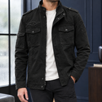 Utility Jacket in Black showing the snap flap pockets and layered front closure.