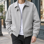 Zip Jacket in Gray showing the paneled construction and ribbed trims