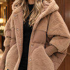 Close view of the light brown textured jacket showing its plush panels and ribbed cuffs