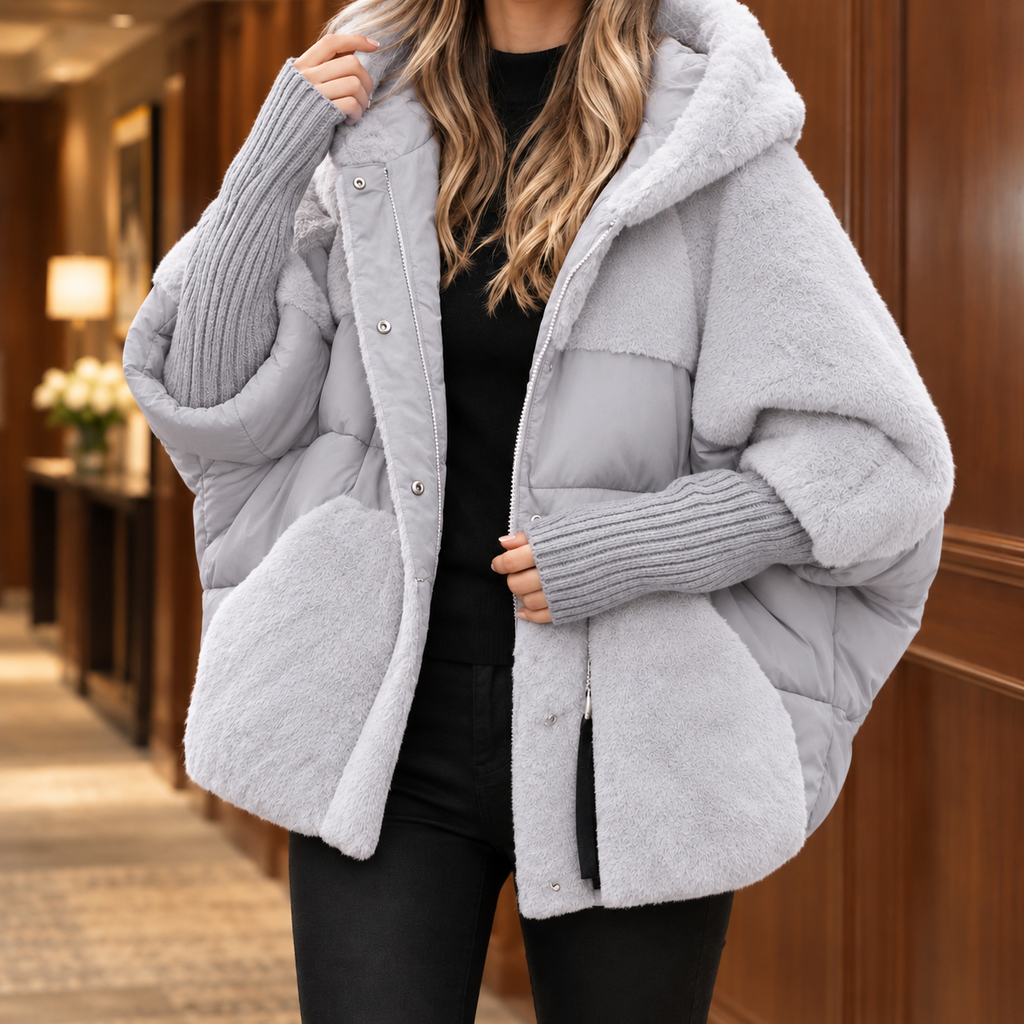 Woman wearing the padded textured hooded jacket in light gray