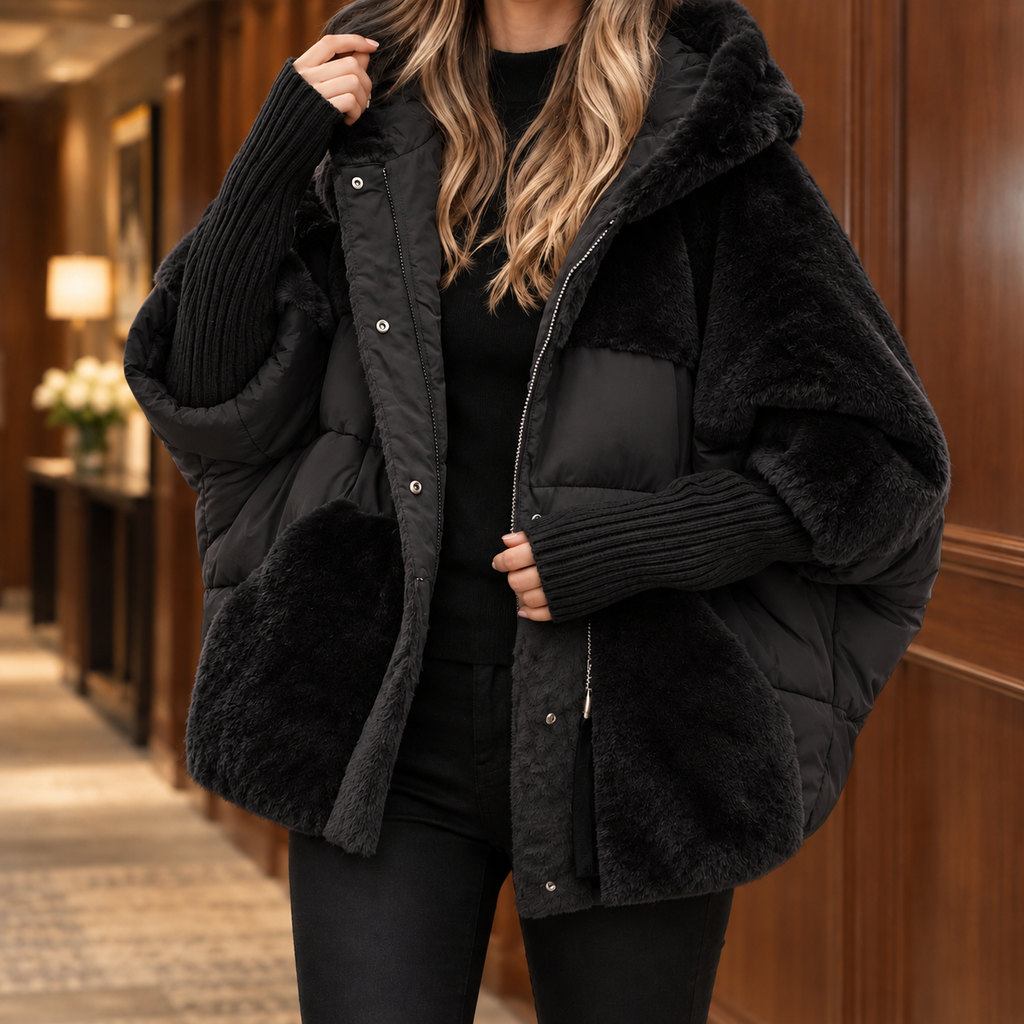 Woman wearing the padded textured hooded jacket in black