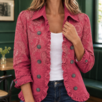 Close view of the rose pink jacket showing its tonal paisley pattern and ruffled edges