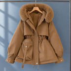 Woman wearing the plush lined hooded parka in brown
