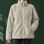 Woman wearing the plush textured zip jacket in beige