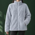 Woman wearing the plush textured zip jacket in light blue