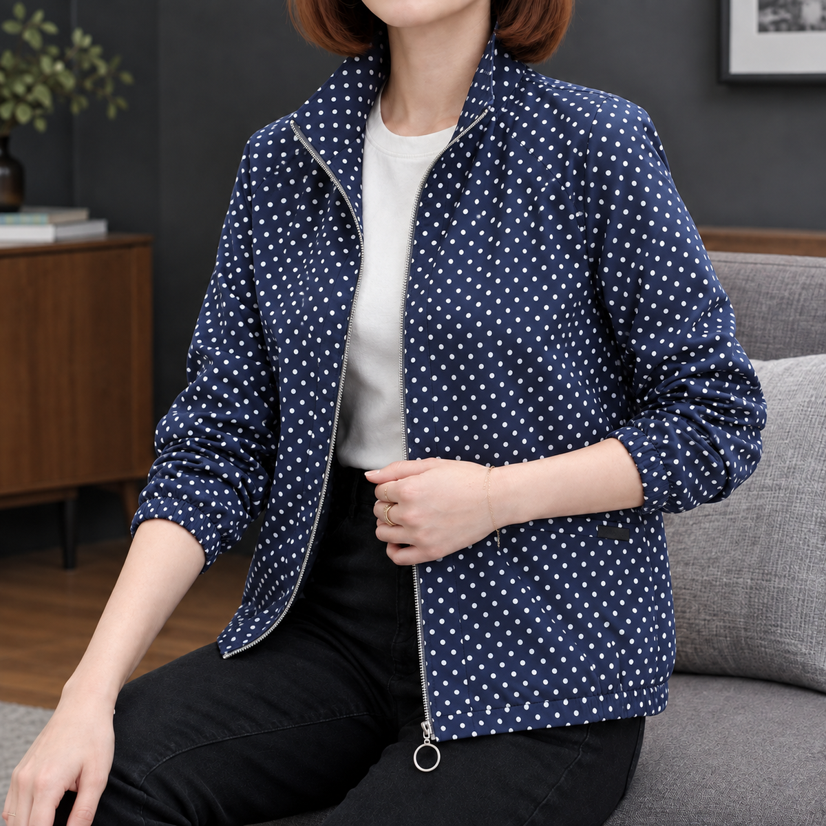 Woman wearing the polka dot zip jacket in royal blue