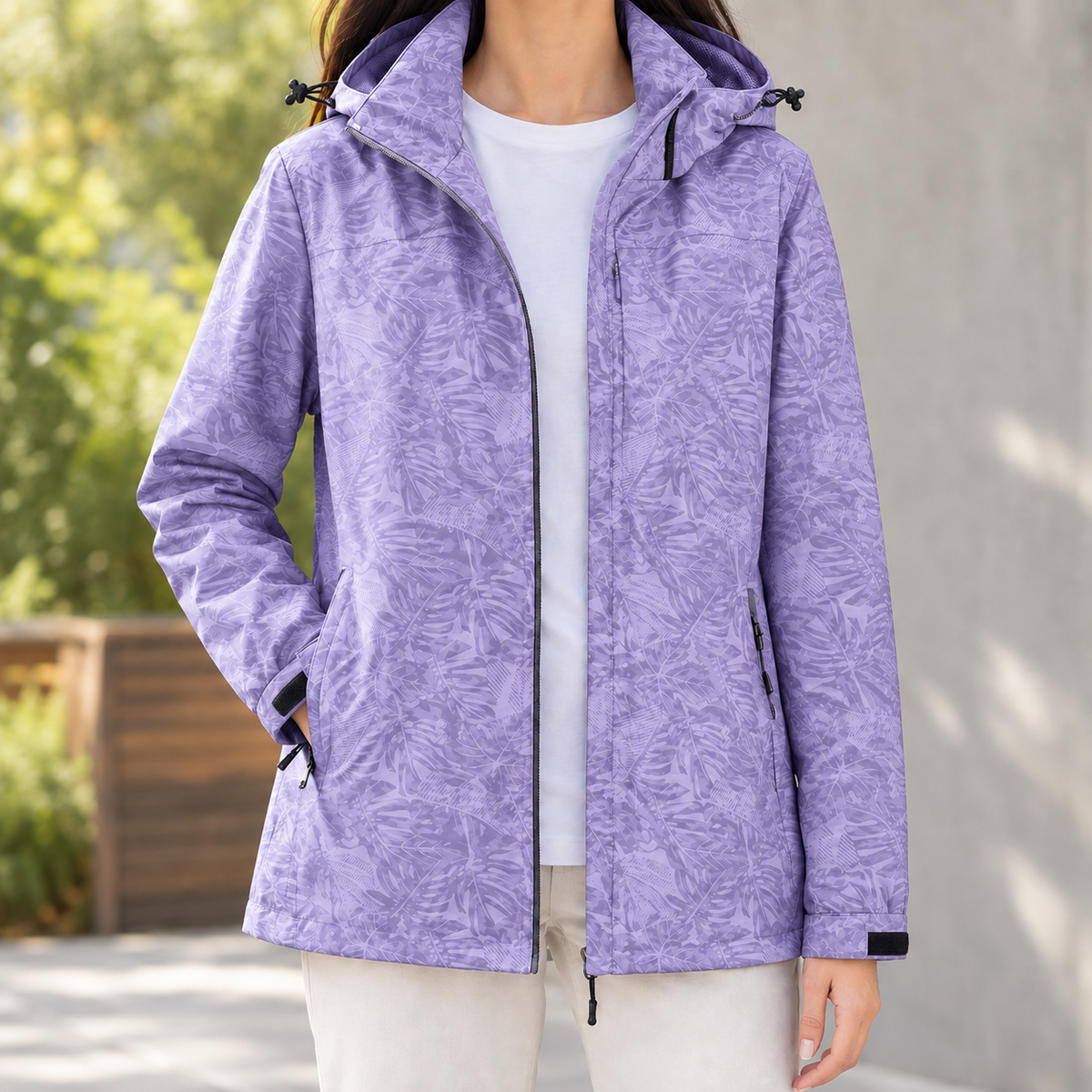 Woman wearing the tonal leaf print hooded jacket in purple