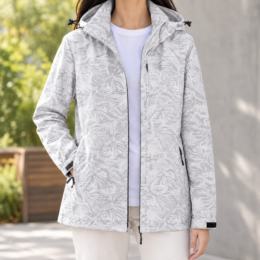 Woman wearing the tonal leaf print hooded jacket in gray