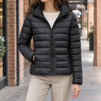 Woman wearing the slim quilted hooded jacket in black