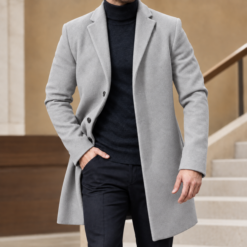 Tailored Coat in Gray showing the notched lapels and shaped mid-length silhouette