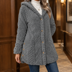 Woman wearing the plush textured hooded jacket in gray