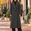Gray overcoats worn on a Washington DC street.