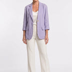 Full-length view of a model wearing the purple cotton blend blazer.