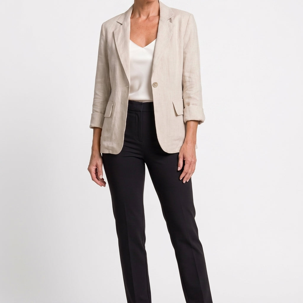 Full-length view of a model wearing the light neutral cotton blend blazer.