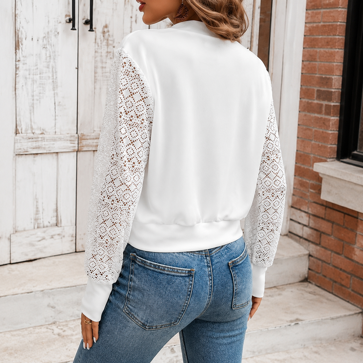 Alternate view of the white crochet sleeve jacket showing the floral sleeves.