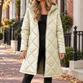 Cream diamond quilted hooded jacket worn on a Washington DC street.