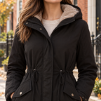 Close-up of the parka showing its hood lining and front fastening.