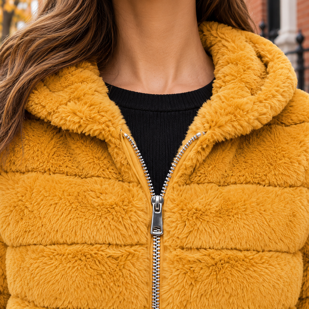 Close-up of the faux fur jacket showing the collar and plush textile texture.